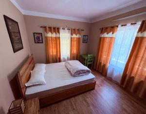 Letto o letti in una camera di DRAKON NEST HOMESTAY