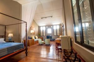 a bedroom with a bed and a living room at Argus Residences in George Town
