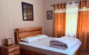 Letto o letti in una camera di DRAKON NEST HOMESTAY