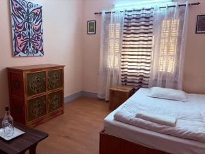 Letto o letti in una camera di DRAKON NEST HOMESTAY