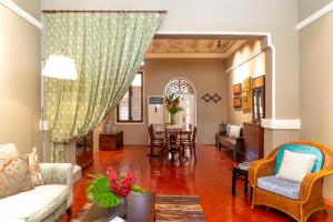 a living room with a couch and a table at Argus Residences in George Town