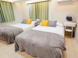 Una cama o camas en una habitación de 2層完全貸切 jr板橋駅徒歩2分 池袋まで電車2分 最大9人