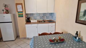 Kuchyň nebo kuchyňský kout v ubytování Apartman Merima