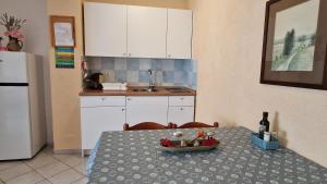 Kuchyň nebo kuchyňský kout v ubytování Apartman Merima