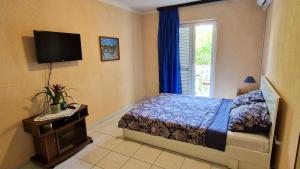 Postel nebo postele na pokoji v ubytování Apartman Merima