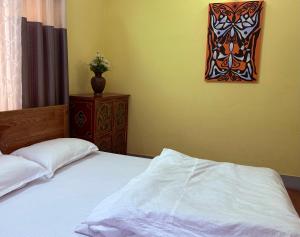 Letto o letti in una camera di DRAKON NEST HOMESTAY