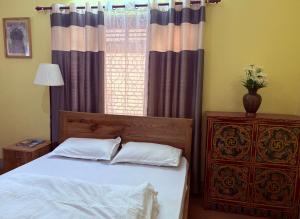 Letto o letti in una camera di DRAKON NEST HOMESTAY