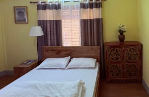 Letto o letti in una camera di DRAKON NEST HOMESTAY