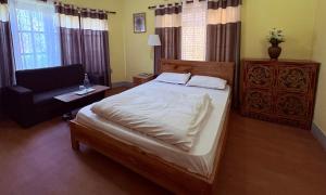 Letto o letti in una camera di DRAKON NEST HOMESTAY
