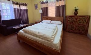 Letto o letti in una camera di DRAKON NEST HOMESTAY