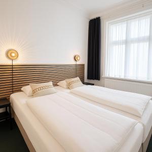 Postel nebo postele na pokoji v ubytování CentralHotellet