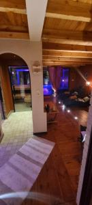 a living room with a person laying on a couch at Étang des Tamaris in Namur +32 photos