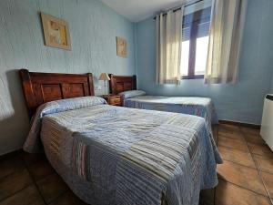 A bed or beds in a room at Alojamientos rurales el hosquillo, lugar de bienestar