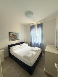 Posteľ alebo postele v izbe v ubytovaní Residenza Le Logge