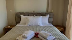 Postel nebo postele na pokoji v ubytování Kolokotronis Hotel & Spa