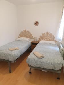 Katil atau katil-katil dalam bilik di Apartamento El roble