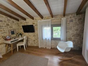 a room with a computer desk and a window at Gem apartment Analipsi in Hersonissos +3 photos