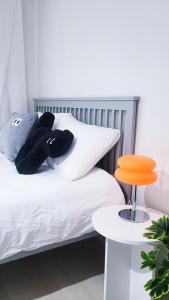 a teddy bear sitting on top of a bed at Seoul Haven 3room KSPO-DOM Family trip in Seoul
