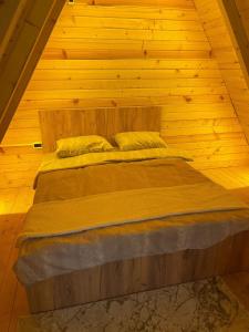Ένα ή περισσότερα κρεβάτια σε δωμάτιο στο Wooden Villa
