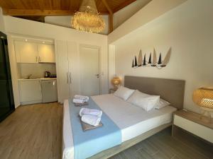 A bed or beds in a room at Alegria Kefalonia