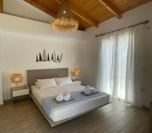 A bed or beds in a room at Alegria Kefalonia