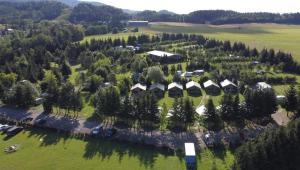 an aerial view of a village with trees and houses at Camping 2000 - Vakantiewoning M in Osečná