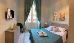 Posteľ alebo postele v izbe v ubytovaní GIRASOLE SUITES
