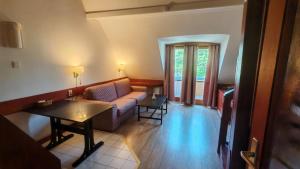 Posezení v ubytování Abbázia Club Hotel Kék