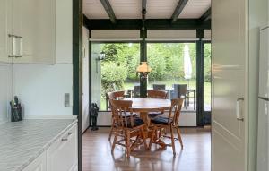 a kitchen with a table and chairs in a kitchen at Beautiful Home In Højby With Wifi in Højby