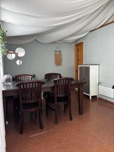 a dining room with a wooden table and chairs at Camping 2000 - Glamourtent in Osečná