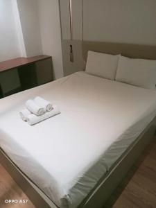 Postel nebo postele na pokoji v ubytování The Mays Inn Hotel