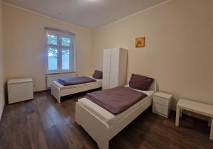 Ένα ή περισσότερα κρεβάτια σε δωμάτιο στο VS Workers Apartment T1-6