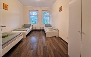 En eller flere senge i et værelse på VS Workers Apartment T1-6