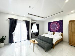 Giường trong phòng chung tại Mandala Home & Coliving Space