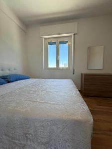 a bedroom with a large bed and a window at Sul Mare - da Angelica in Termoli