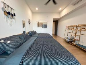 a large bedroom with two beds in a room at Bay Suite Likas by IGVC in Kota Kinabalu