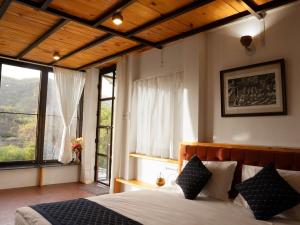 Postel nebo postele na pokoji v ubytování Grihum Farms