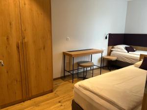 A bed or beds in a room at Dining & Living Alpenrose