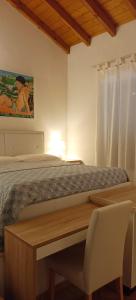 A bed or beds in a room at B&B Villa Bucceri