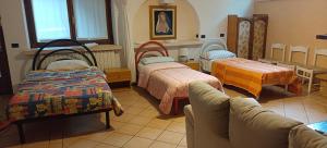 A bed or beds in a room at B&B Villa Bucceri