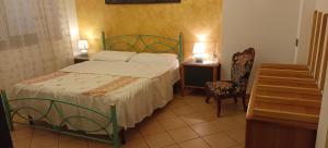 A bed or beds in a room at B&B Villa Bucceri