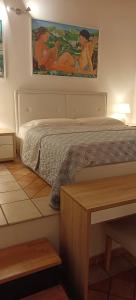 A bed or beds in a room at B&B Villa Bucceri