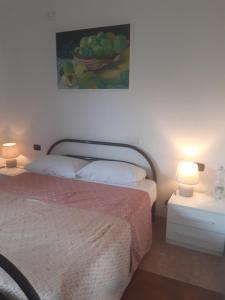 A bed or beds in a room at B&B Villa Bucceri