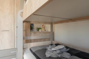 Postelja oz. postelje v sobi nastanitve Vision apartmani Goč