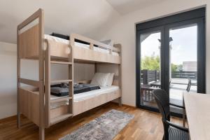 Postelja oz. postelje v sobi nastanitve Vision apartmani Goč