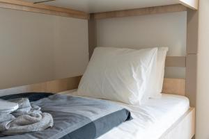 Postelja oz. postelje v sobi nastanitve Vision apartmani Goč