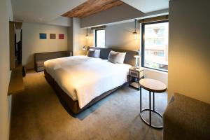 Postel nebo postele na pokoji v ubytování Hotel Resol Akihabara