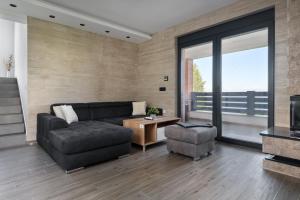 Predel za sedenje v nastanitvi Vision apartmani Goč