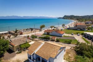 an aerial view of a town with a beach at Elysee Seaview Apartments in Sidari