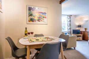 a dining room with a table and chairs at Bovis Cottage, Southwold in Southwold